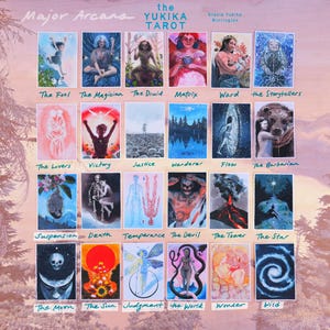 May include: A collection of twenty-four rectangular tarot cards titled The Yukika Tarot by Stasia Yukika Burrington. Each card features a unique, colorful illustration with a handwritten label below it, including titles like The Fool, The Magician, The Druid, Matrix, Ward, The Storytellers, The Lovers, Victory, Justice, Wanderer, Flow, The Barbarian, Suspension, Death, Temperance, The Devil, The Tower, The Star, The Moon, The Sun, Judgment, The World, Wonder, and Wild.