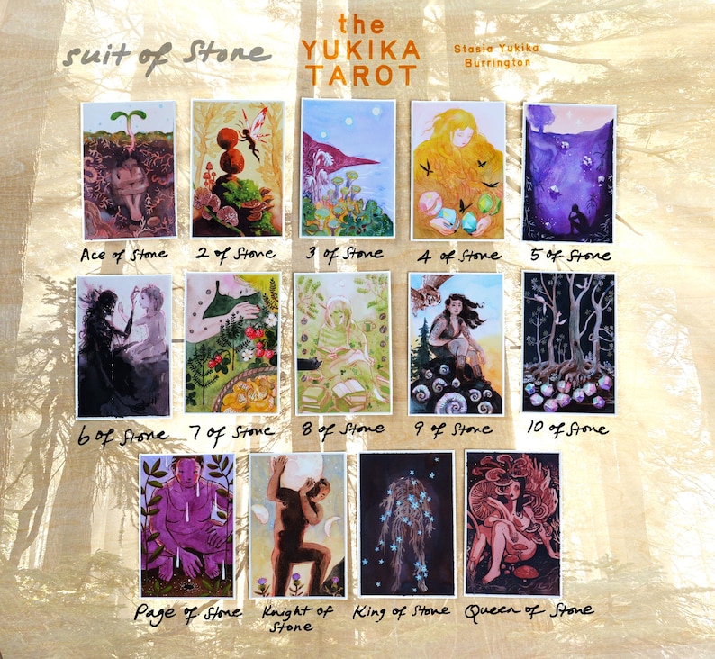 May include: A collection of fourteen tarot cards titled The Yukika Tarot Suit of Stone, featuring colorful watercolor illustrations. Each card displays unique imagery, including figures, nature, and mystical scenes, with handwritten labels below each card.
