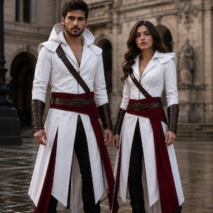 May include: Two individuals wearing matching white hooded long coats with deep red waist sashes, brown leather belts, and dark brown forearm bracers. The coats feature a structured collar, a front zipper, and a split-panel skirt design over black pants.