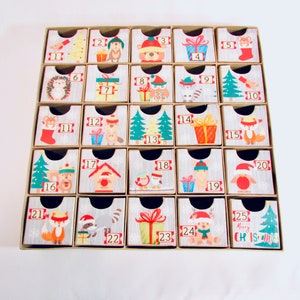 Woodland wonder animals decorate this unique handmade heirloom quality advent calendar.  A reusable year-after-year countdown to Christmas set of mini drawers will be a favorite decoration for years to come.