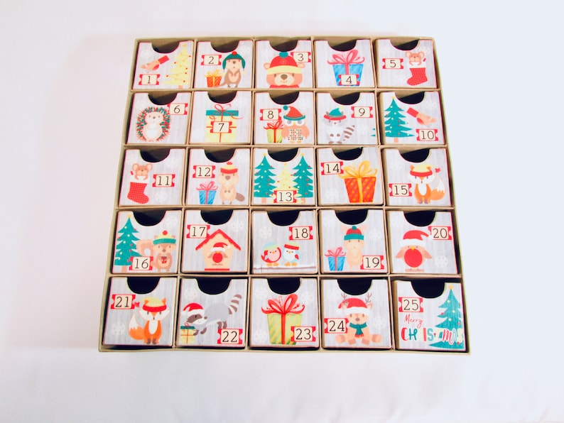 Woodland wonder animals decorate this unique handmade heirloom quality advent calendar.  A reusable year-after-year countdown to Christmas set of mini drawers will be a favorite decoration for years to come.