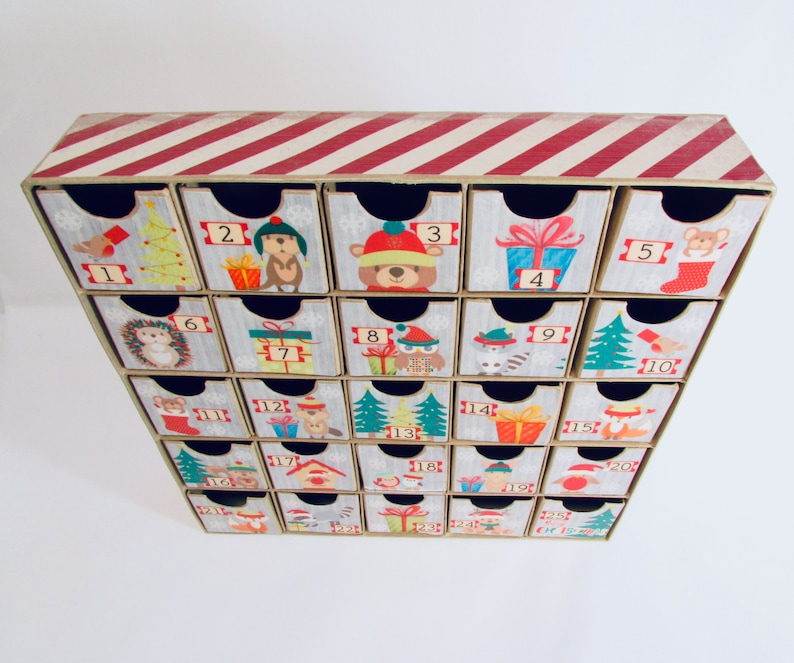 Woodland wonder animals decorate this unique handmade heirloom quality advent calendar.  A reusable year-after-year countdown to Christmas set of mini drawers will be a favorite decoration for years to come.