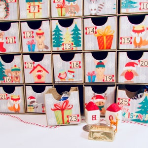 Woodland wonder animals decorate this unique handmade heirloom quality advent calendar.  A reusable year-after-year countdown to Christmas set of mini drawers will be a favorite decoration for years to come.