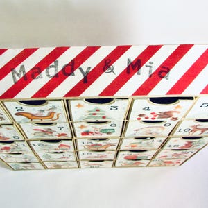 Woodland wonder animals decorate this unique handmade heirloom quality advent calendar.  A reusable year-after-year countdown to Christmas set of mini drawers will be a favorite decoration for years to come.