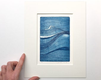 original color etching and aquatint in blue: a swimmer out in the open water