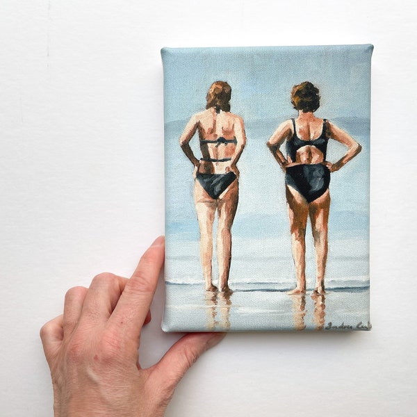 two women wearing swimsuits looking out to sea, mini canvas art print
