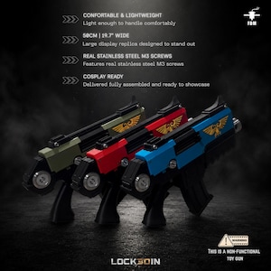 May include: Three non-functional toy gun replicas in olive green, red, and blue, each featuring a gold eagle emblem, black handle, and stainless steel M3 screws. The items measure 50 cm wide and are fully assembled for display purposes.