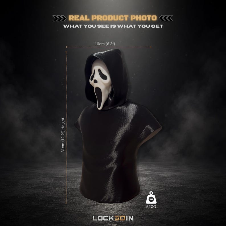 May include: A black hooded bust featuring a white ghost-like mask with hollow eyes and an elongated mouth. The figure measures 6.3 inches in width and 12.2 inches in height, with a weight of 520 grams. Text includes REAL PRODUCT PHOTO and LOCK3DIN.