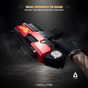 May include: A black and red prop blaster featuring a gold eagle emblem on the side. The device measures 50 cm in length and weighs 1160 g. Text on the image reads: REAL PRODUCT IN HAND, WHAT YOU SEE IS WHAT YOU GET, and LOCK3DIN.