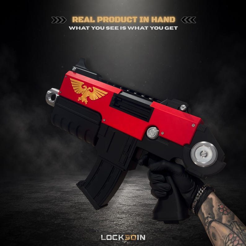 May include: A red and black toy blaster featuring a gold eagle emblem on the side. The text REAL PRODUCT IN HAND WHAT YOU SEE IS WHAT YOU GET is printed at the top, and the word LOCK3DIN is printed at the bottom of the image.