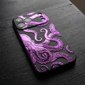 May include: Black phone case with a raised, metallic purple octopus design. The case has cutouts for the camera and buttons. The octopus tentacles are detailed and textured, creating a 3D effect. The case is on a dark wooden surface.