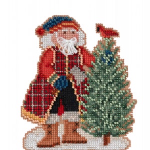 May include: A red and green plaid Santa Claus holding a small Christmas tree with a cardinal perched on top. The Santa is wearing a blue hat and has a white beard. The background is white.