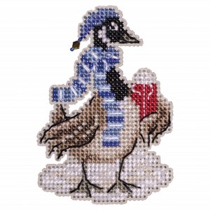 May include: A beaded ornament of a goose wearing a blue and white striped scarf and a blue hat, holding a red gift box. The goose is standing on a white background.