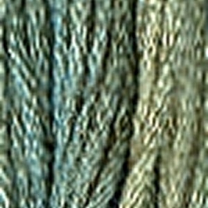 May include: Close-up of a textured fabric with a blue and green color scheme. The fabric has a woven appearance and a slightly iridescent sheen.