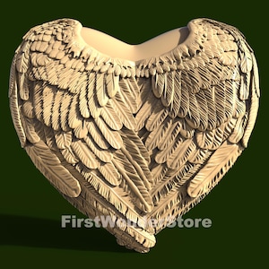 May include: A heart-shaped sculpture made of a light brown material, with a detailed design of overlapping feathers forming wings.
