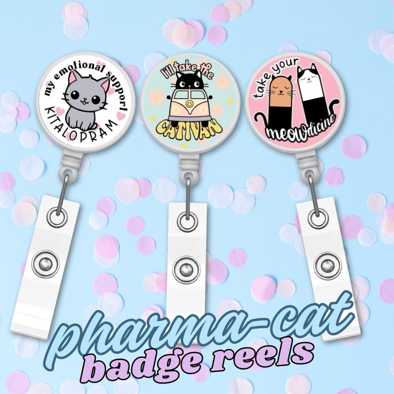 May include: Three white badge reels with cat-themed designs. One reel has a gray cat and the text "my emotional support KITALOPRAM". Another has a black cat in a van with the text "I'll take the CATIVAN". The third has two cats and the text "take your meowdicine". The words "pharma-cat badge reels" are written below.