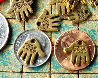 240 tiny hand shape charms, goldtone metal,  say HAND MADE, small metal hang tags, great on your handmade items