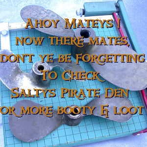 May include: Four bronze boat propellers on a blue and white grid surface. The propellers are arranged in a circle with the text "Ahoy Mateys! Now there mates, don't ye be forgetting to check Salty's Pirate Den for more booty & loot!" in orange text.