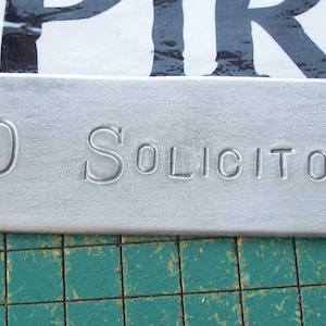 No Solicitors,  hand stamped, aluminum, doorbell warning sign