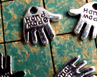 240 tiny hand shaped charms, say HAND MADE, silvertone, small metal hang tags, great on your handmade items