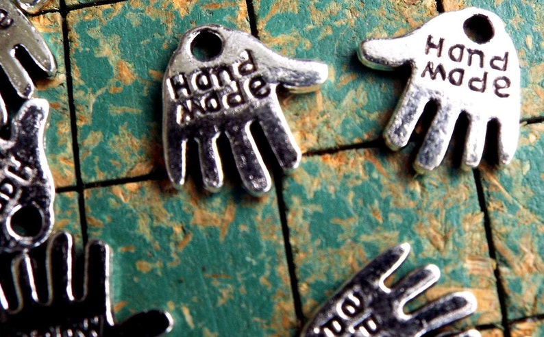 240 tiny hand shaped charms, say HAND MADE, silvertone, small metal hang tags, great on your handmade items image 1