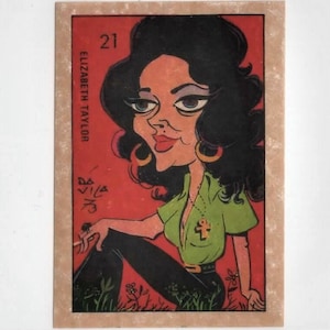 May include: A caricature of Elizabeth Taylor on a red background with the number 21 and her name printed on the left side. The caricature shows her with dark hair, wearing a green shirt with a gold pendant, black pants, and large hoop earrings.