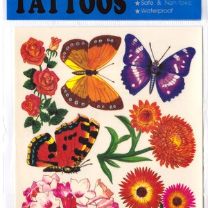 May include: A sheet of temporary tattoos featuring colorful butterflies and flowers. The tattoos are easy to apply and remove, and they are safe and non-toxic.