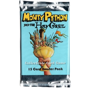 May include: A sealed card booster pack for the Monty Python and the Holy Grail collectible card game. The pack features a light blue background with a golden chalice holding a castle and spears. Text includes "Monty Python and the Holy Grail" and "15 Card Booster Pack."