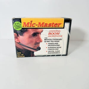 May include: A box for a Mic-Master universal boom microphone. The box is black and yellow with the product name and a picture of a man wearing the microphone. Text on the box includes "Hands-free microphone!" and "Superior noise cancelling!"