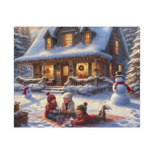 May include: Three children are sitting on a red blanket in the snow outside a cosy, snow-covered house with lit windows and a snowman in the yard. The children are wearing winter clothes and holding mugs.