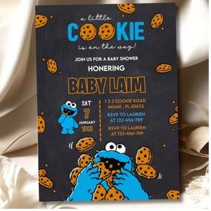May include: A baby shower invitation with a dark gray background and a cookie theme. The text reads "a little COOKIE is on the way!" and includes details for the event, such as the date, time, and location. The invitation features a blue Cookie Monster character.