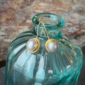 grey pearl set in 18k.