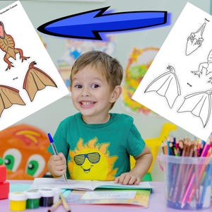 May include: A young child smiles while sitting at a desk with art supplies. Two sheets of paper with dinosaur illustrations are on the desk. One sheet is colored, and the other is a black and white outline. The child is wearing a green shirt with a sun graphic.
