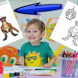 May include: A young child smiles while holding a pen, with dinosaur cutouts on a white paper. The cutouts include a dinosaur head and body, with the text "Velociraptor Cutouts" at the top. The child is wearing a green shirt with a sun graphic.