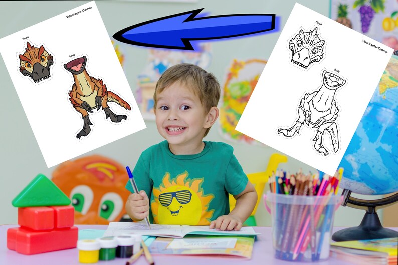 May include: A young child smiles while holding a pen, with dinosaur cutouts on a white paper. The cutouts include a dinosaur head and body, with the text "Velociraptor Cutouts" at the top. The child is wearing a green shirt with a sun graphic.