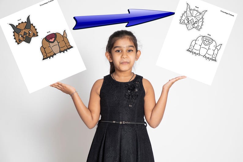 May include: A young person holds two white sheets with dinosaur head and body illustrations. One sheet shows a colored dinosaur, the other a black and white outline. A blue arrow points from the colored dinosaur to the outline.