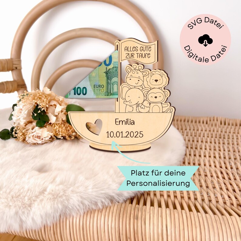 May include: Wooden sailboat money box with a slot for bills, featuring a giraffe, lion, elephant, and monkey. The box is personalised with the name "Emilia" and the date "10.01.2025".