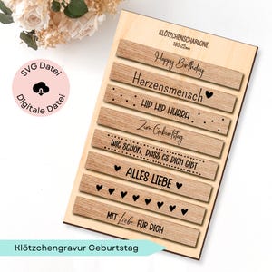 May include: A wooden birthday-themed plaque with engraved text. The plaque features multiple wooden slats with phrases like "Happy Birthday" and "Alles Liebe." The dimensions are 160mm x 22mm.