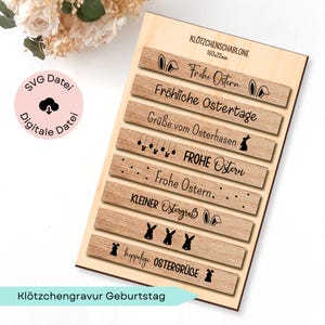 May include: A wooden Easter-themed craft template with engraved text and bunny illustrations. The template includes phrases like "Frohe Ostern" and "Happy Easter" in a decorative font. The dimensions are 160x22mm.