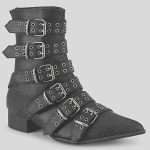 May include: Black ankle boot with multiple straps and silver buckles. The boot has a pointed toe and a low heel. The straps are decorated with silver eyelets. The boot has a side zip.