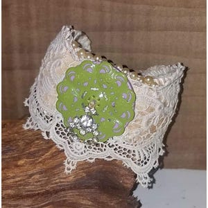 May include: A set of three ceramic mugs with a speckled, matte finish. The mugs are in shades of cream, light gray, and dark gray. Each mug has a simple, minimalist design and a rounded handle.