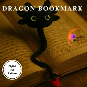 May include: A black crochet dragon bookmark with yellow eyes and a red heart-shaped tail. The bookmark is placed in an open book. Text on the image reads "DRAGON BOOKMARK" and "Digital PDF Pattern".