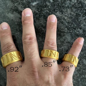 May include: Three gold-coloured bands featuring the embossed letters PIN. The rings are labelled with imperial measurements of .92 inches, .85 inches, and .73 inches respectively, indicating their specific widths or diameters.