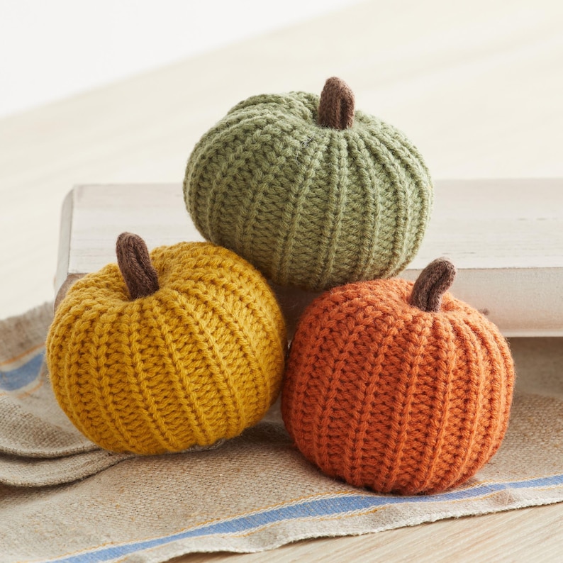Yellow, orange, and green knit pumpkins