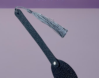 The bookmark shown is a black pebbled leather tassel bookmark