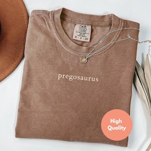 koszulka z pregozaurem, koszulka z ogłoszeniem ciąży, koszulka z ujawnieniem ciąży, prezent na baby shower, zabawna koszulka ciążowa, koszulka dla przyszłej mamy