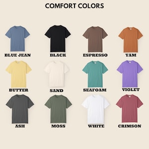 K&ouml;nnte beinhalten: Eine Auswahl an kurz&auml;rmeligen T-Shirts in verschiedenen Farben, darunter Blue Jean, Schwarz, Espresso und Yam. Das Bild zeigt die Shirts mit den Farbbezeichnungen darunter. Der Text "COMFORT COLORS" steht oben.