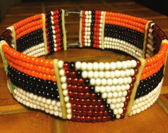 Hand Beaded Cuff Bracelet-Vibrant Fall colors-Orange, Black, Red & White geometric pattern. Ethnic Hippy Boho Tribal