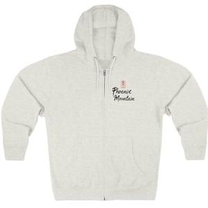 May include: A light gray zip-up hoodie with a hood and front pockets. The hoodie features the text "Phoenix Mountain" in a script font, with a small red square above the text.