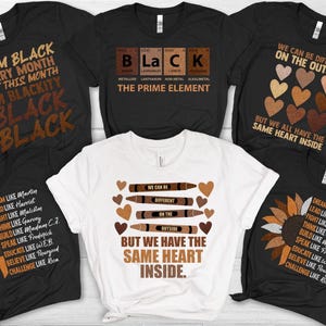 May include: Six different t-shirts with black backgrounds and brown text. The shirts feature various messages about Black identity and pride, including "I am Black Every Month But This Month I'm Blackity Black Black", "BLaCK The Prime Element", "We Can Be Different On The Outside But We All Have The Same Heart Inside", and "Dream Like Martin Lead Like Harriet Fight Like Malcolm Think Like Garvey Build Like Madam C.J. Speak Like Frederick  Educate Like WEB Believe Like Thurgood Challenge Like Rosa".